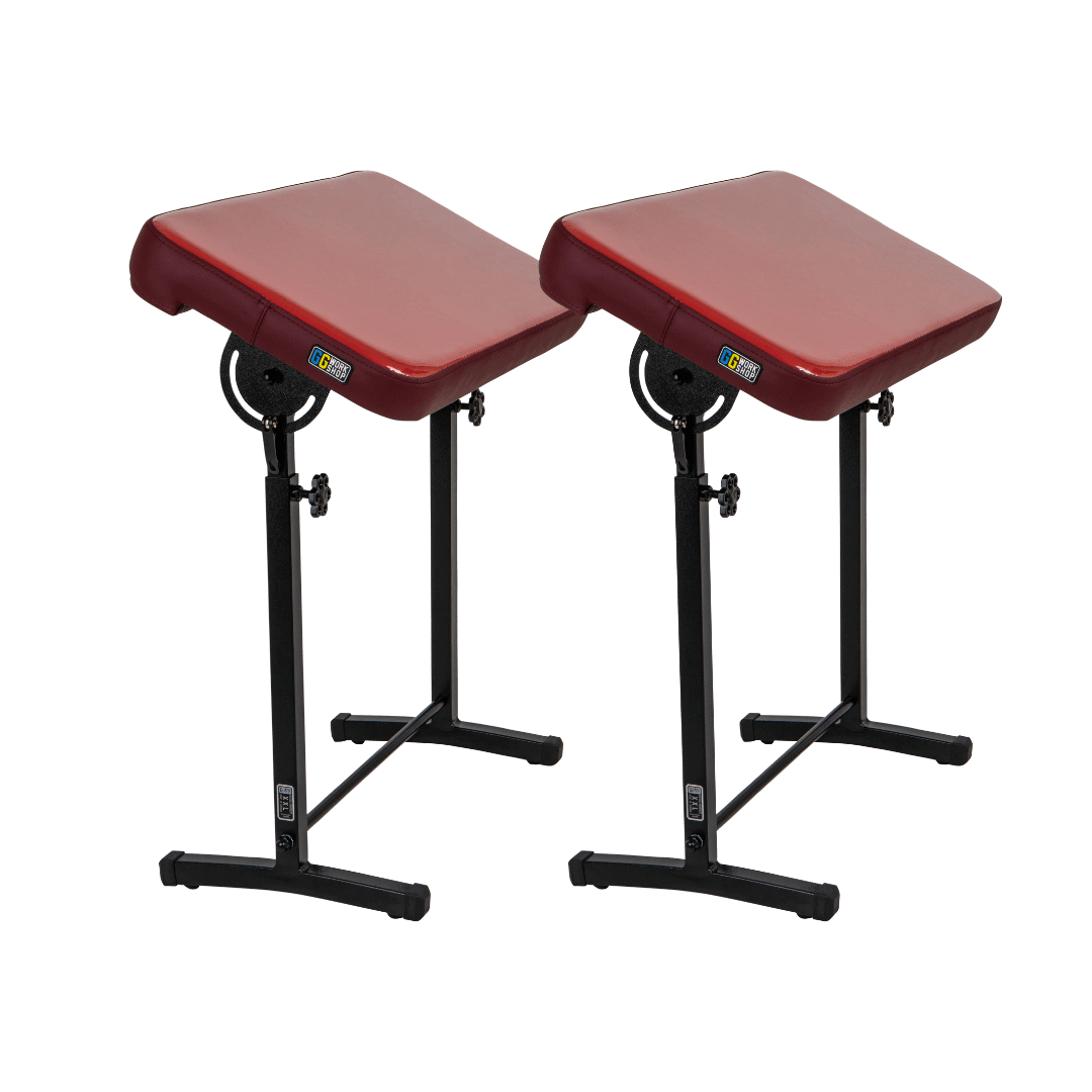Pair of adjustable tattoo armrests with red vinyl pillows for client comfort