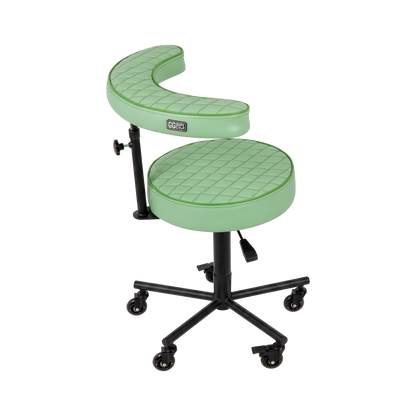 Pistachio green Tattoo Artist Chair V3 by GG Workshop — rhombus stitched cushions with black powder-coated frame, side view