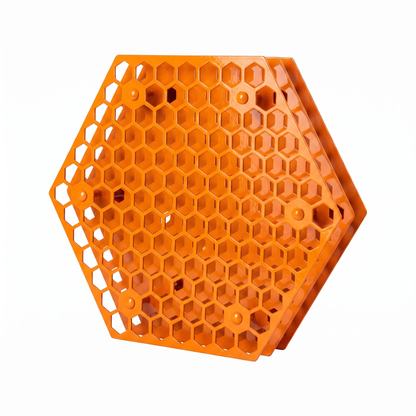 Orange hexagonal Tattoo Ink Wheel - Rotary Rack by GG Workshop — layered honeycomb-pattern plates, angled view
