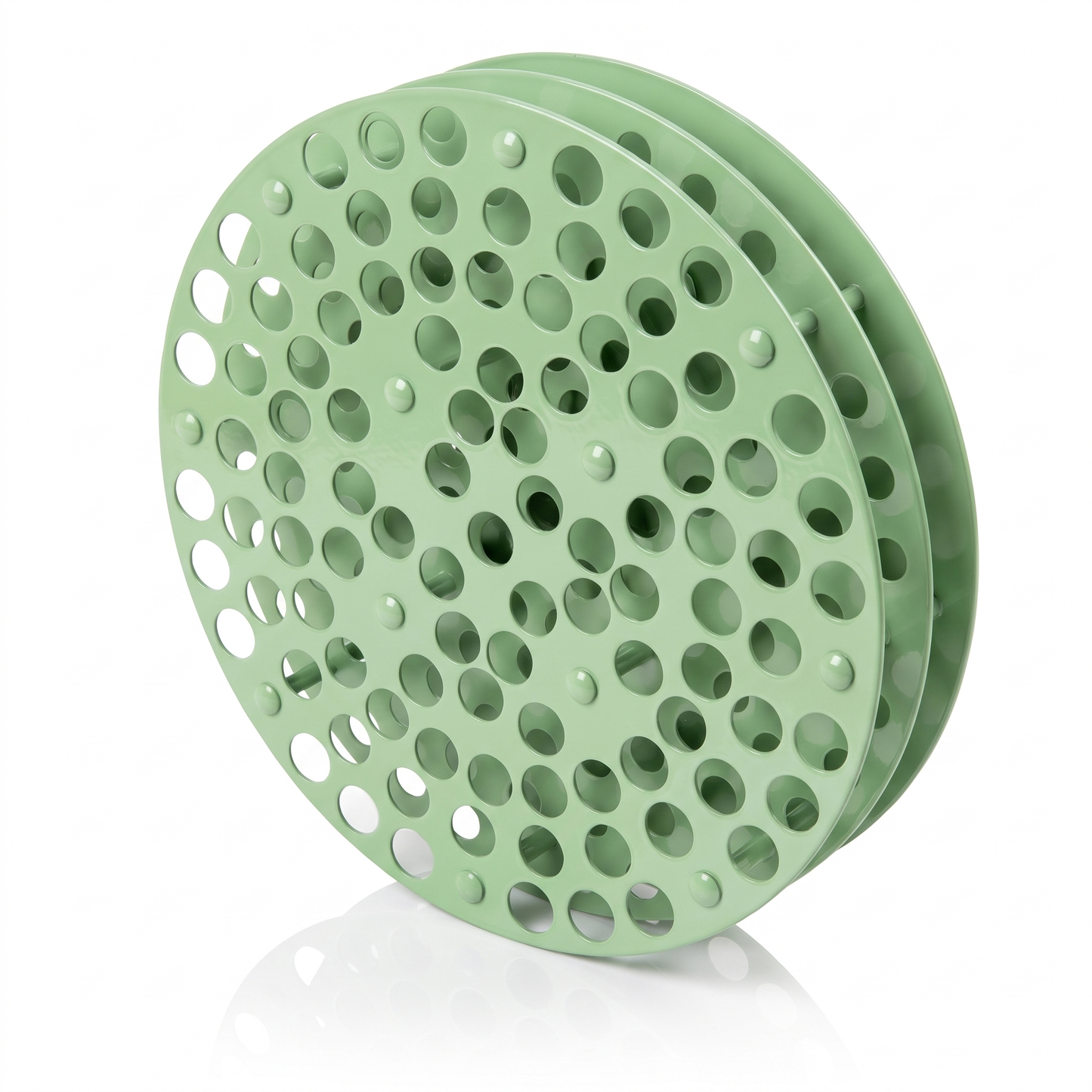 Pistachio green round Tattoo Ink Wheel - Rotary Rack by GG Workshop — stacked perforated discs, angled view